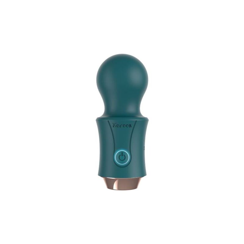 Bacchetta del viaggiatore verde XOCOON, elegante e compatta, con dettagli in legno e impugnatura ergonomica.