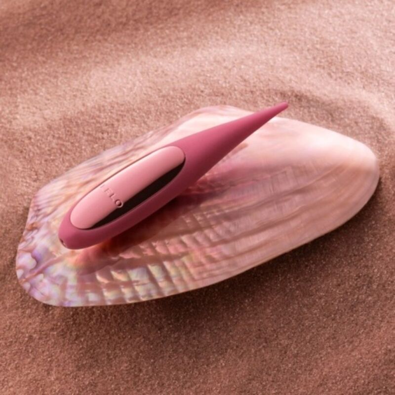 Stimolatore clitoride rosa LELO DOT TRAVEL, compatto e portatile, con design ergonomico e superficie morbida.