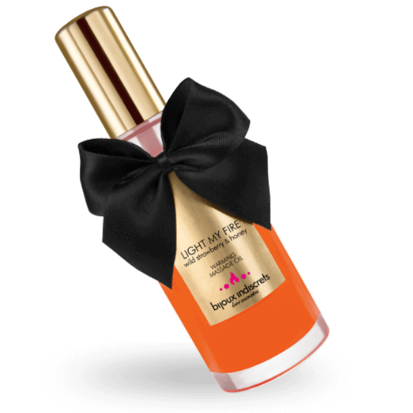 Olio da massaggio BIJOUX LOVE COSMETIQUES con aroma fragola, effetto caldo, bottiglia elegante, ideale per trattamenti rilassanti.