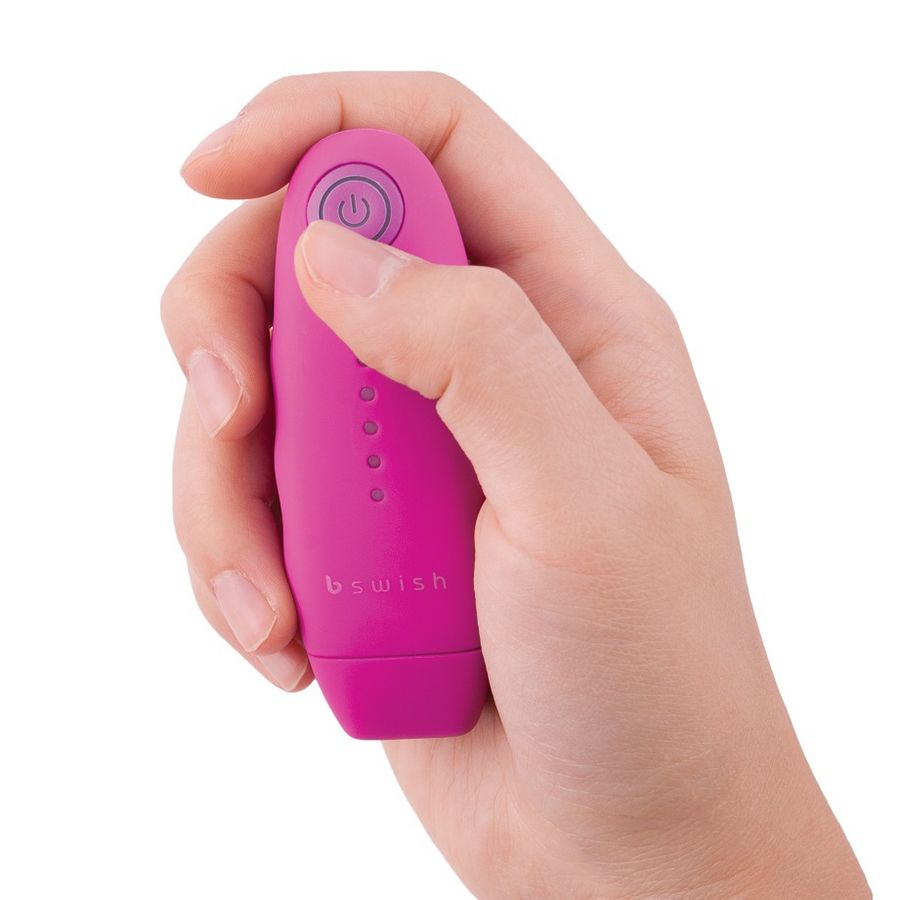 Telecomando rosa classico B SWISH Unleashed con design elegante e pulsanti visibili, ideale per controllare dispositivi compatibili.