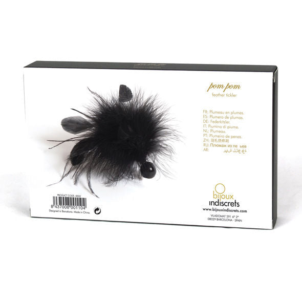 Spolverino in piuma con pom pom di bijoux-indiscrets, decorativo e leggero, ideale come accessorio di moda elegante e giocoso.