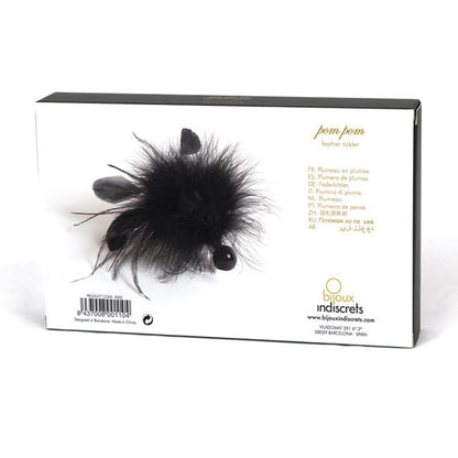 Spolverino in piuma con pom pom di bijoux-indiscrets, decorativo e leggero, ideale come accessorio di moda elegante e giocoso.