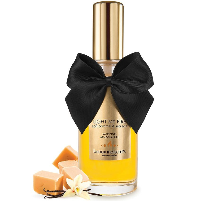 Olio da massaggio BIJOUX LOVE COSMETIQUES con effetto caldo e aroma a caramello, bottiglia con etichetta e tappo.