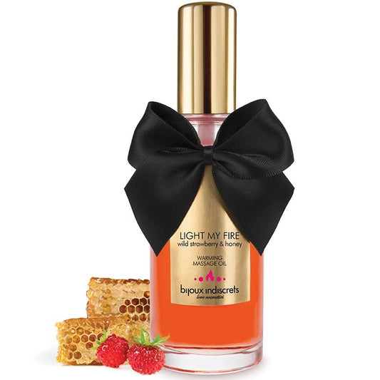 Olio da massaggio BIJOUX LOVE COSMETIQUES con effetto caldo e aroma fragola, bottiglia con etichetta e tappo in primo piano