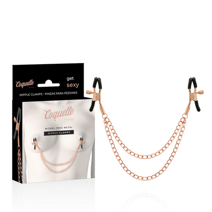 Clips per capezzoli in metallo fantasia con catena, prodotto Coquette Fantasy, dettagli decorativi e stile sexy.