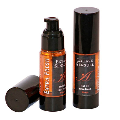 Olio stimolante al mango EXTASE SENSUAL, 30 ml, bottiglia trasparente con etichetta colorata e tappo nero.