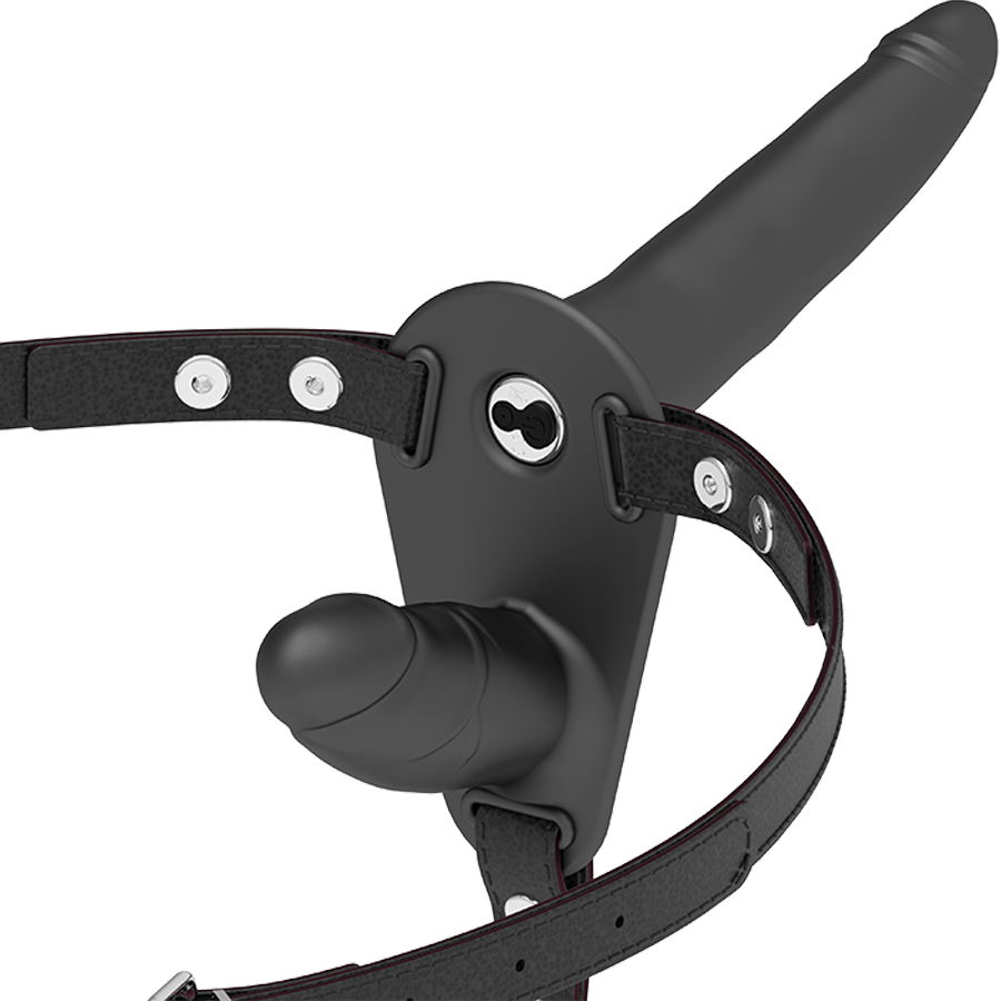Immagine di un vibratore nero a doppia penetrazione del marchio FETISH SUBMISSIVE HARNESS, con design realistico e dettagliando la forma.