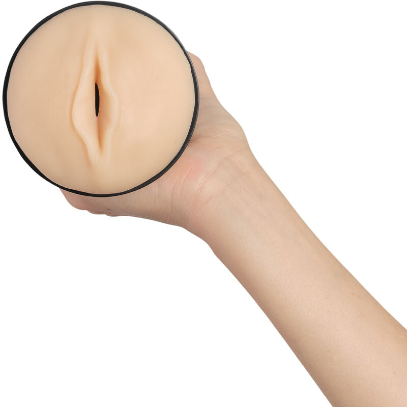 Stroker generico pallido KIIROO, dispositivo di stimolazione, con design semplice e colore chiaro, visibile in primo piano.