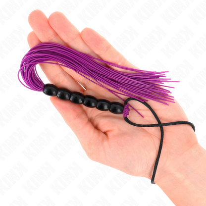 Mini frusta in silicone KINK con 6 perline viola, lunga 26 cm, morbida e flessibile, ideale per giochi intimi.