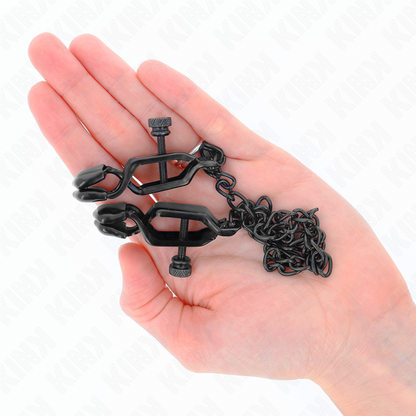 Morsetti per capezzoli KINK NIPPLE GRIP, catena piatta nera di 30 cm, mostrati in primo piano con dettagli metallici.