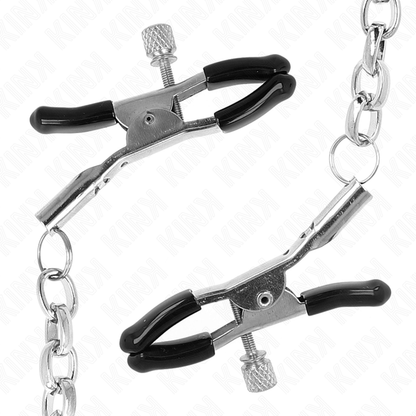 Morsetti per capezzoli con catena spessa di 30 cm, marchio KINK NIPPLE GRIP, visibili in primo piano su sfondo neutro.