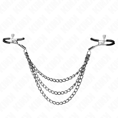 Pinze per capezzoli KINK NIPPLE GRIP con tre catene nere di 20, 23 e 28 cm, visibili in primo piano sull'immagine.