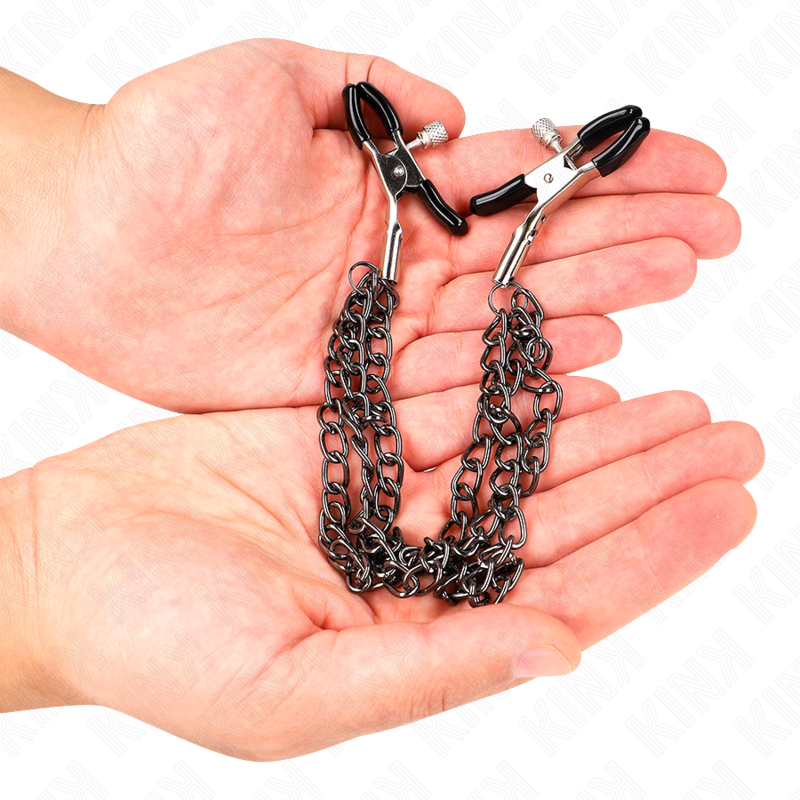 Pinze per capezzoli KINK NIPPLE GRIP con tre catene nere da 20 a 28 cm, metallo e design resistente.