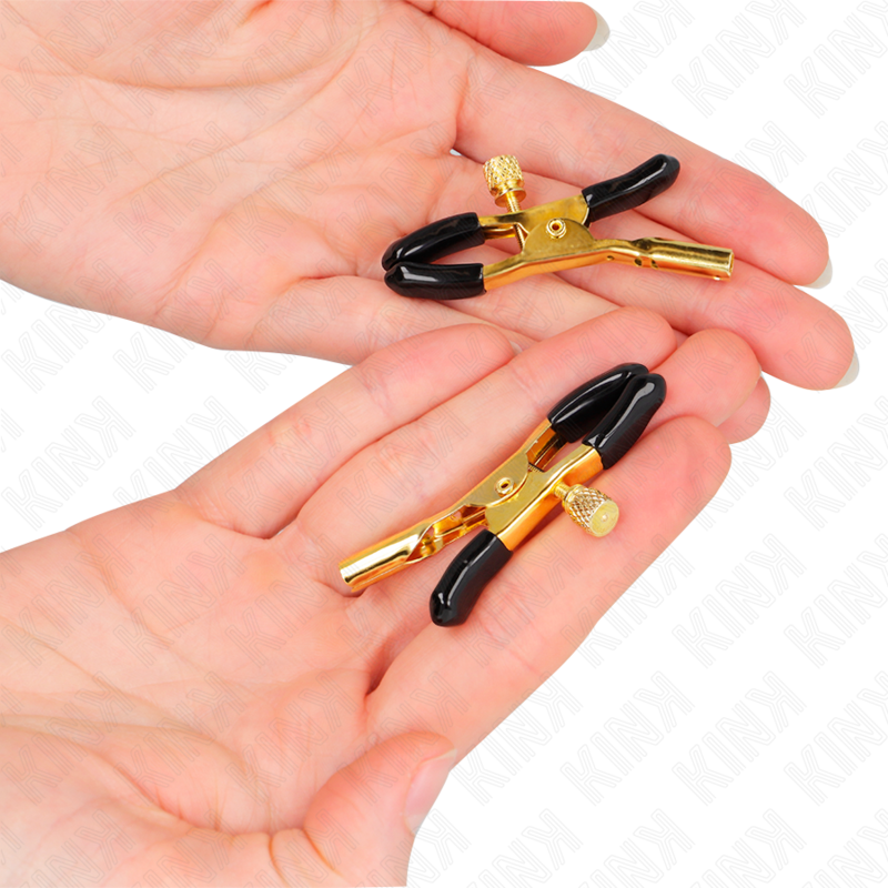 Pinze per capezzoli KINK NIPPLE GRIP in oro, lunghezza 6 cm, con design robusto e dettagli eleganti, ideali per uso sensoriale.