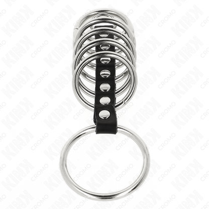 Anelli per pene in metallo KINK RING POWER, da 3,2 cm a 5 cm, collegati da pelle, mostrati in primo piano in immagine.