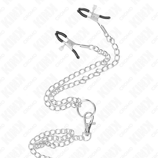 Anello per pene KINK in metallo cromato con catena da 26 cm e clip per capezzoli, diametro da 3 a 4,5 cm, in immagini dettagliate.