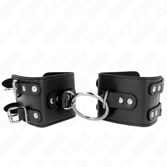 Polso fisso nero KINK WRIST RESTRAINT con anello e borchie regolabile da 17 a 22 cm, misura 6,5 cm.