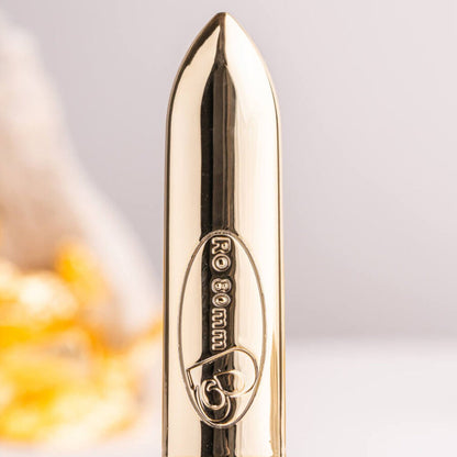 Proiettile vibrante ROCKS-OFF RO-80 Champagne Golden, dispositivo stimolante di alta qualità, con design elegante e superficie dorata brillante.